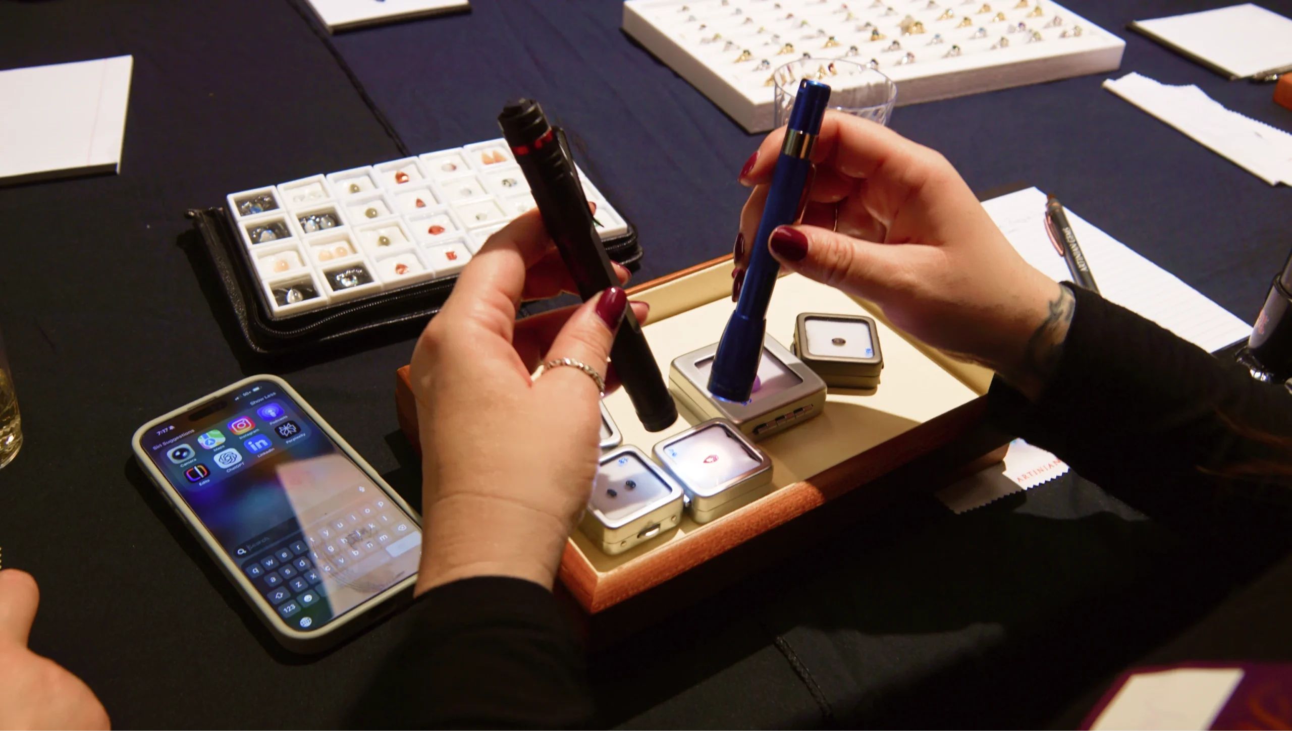 Examining color-change gemstones under flashlight